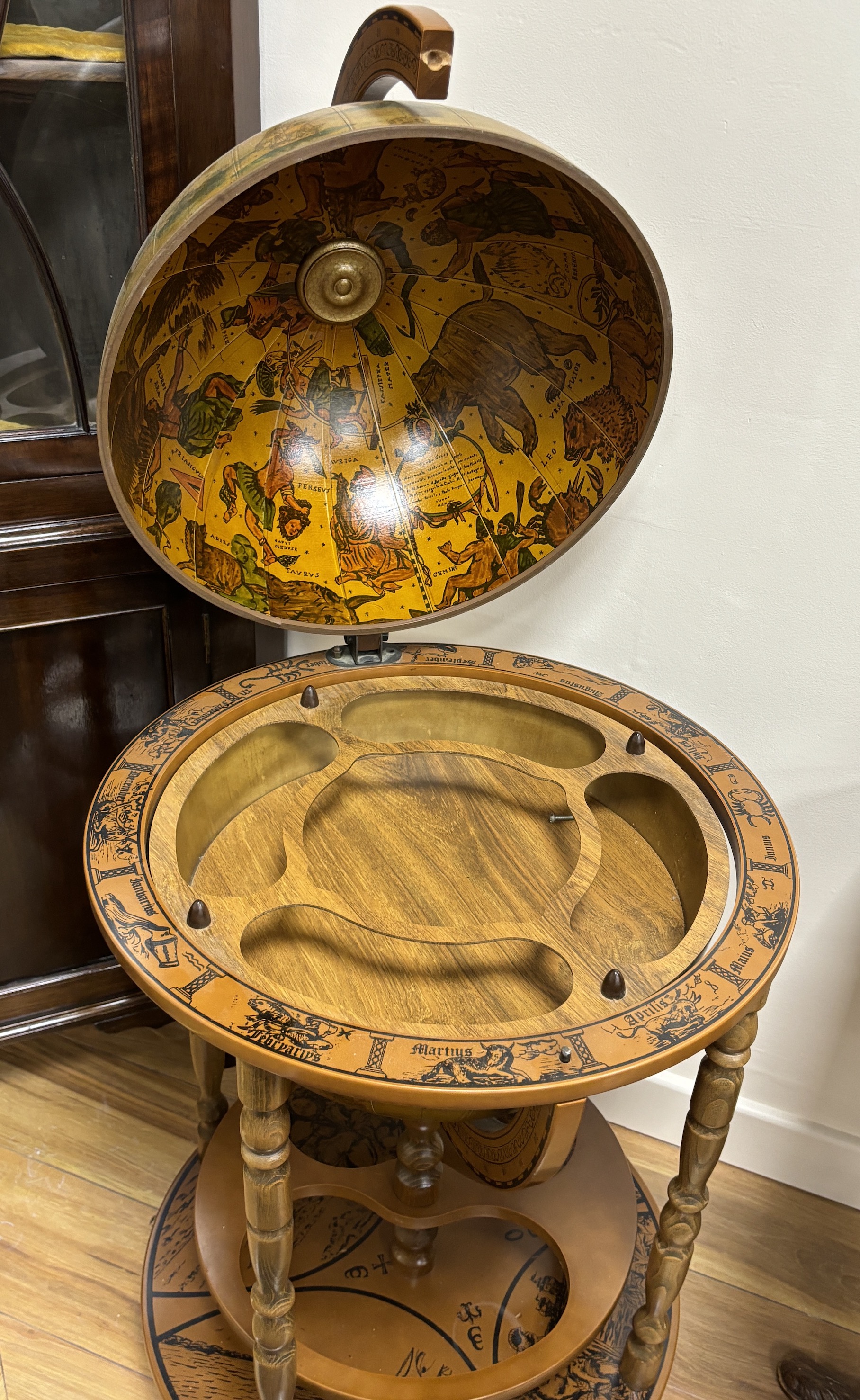 A reproduction globe drinks trolley, height 92cm